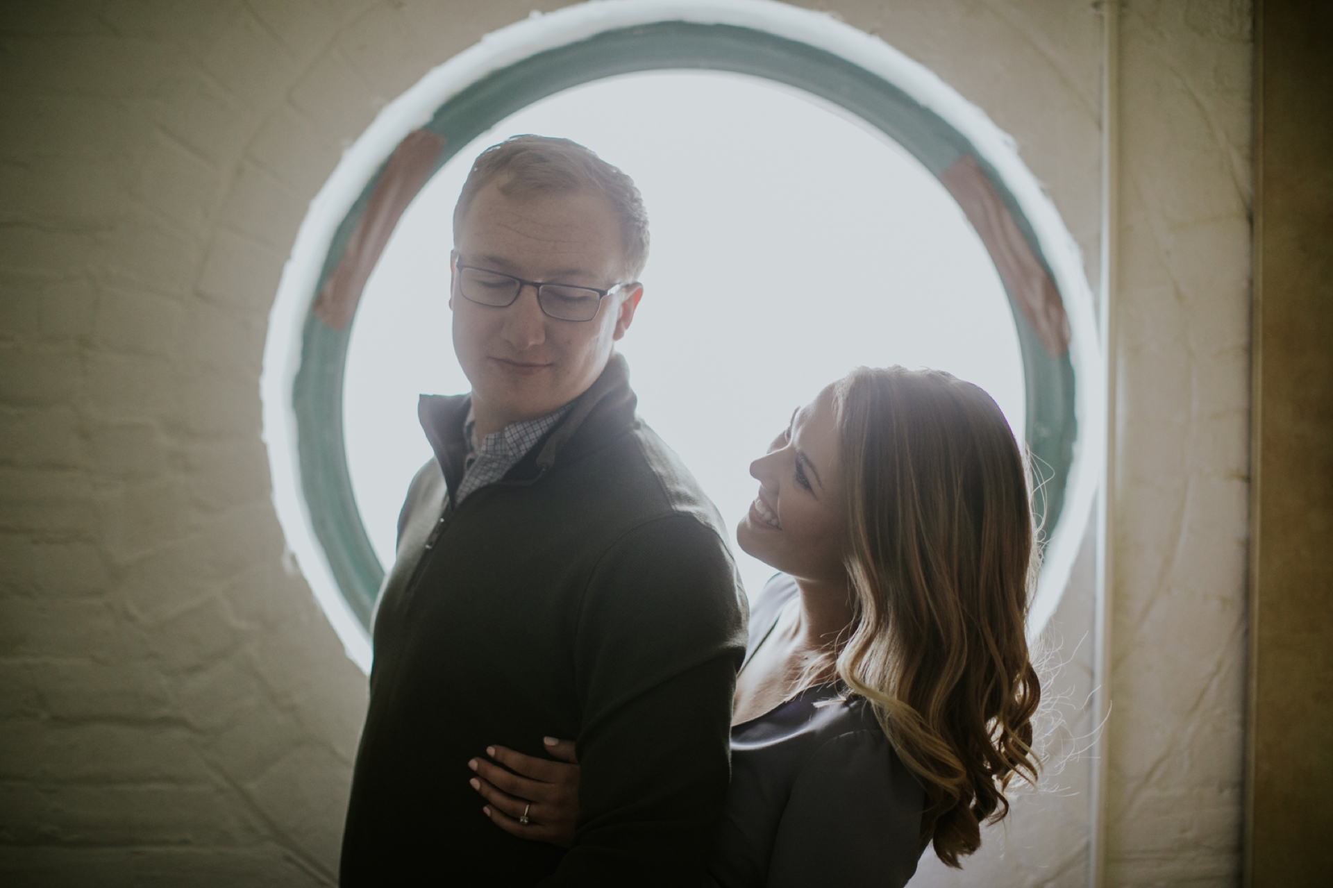Engagement Photo Session Blonde Couple Back Lit Circular Window Athenaeum Theater Indy