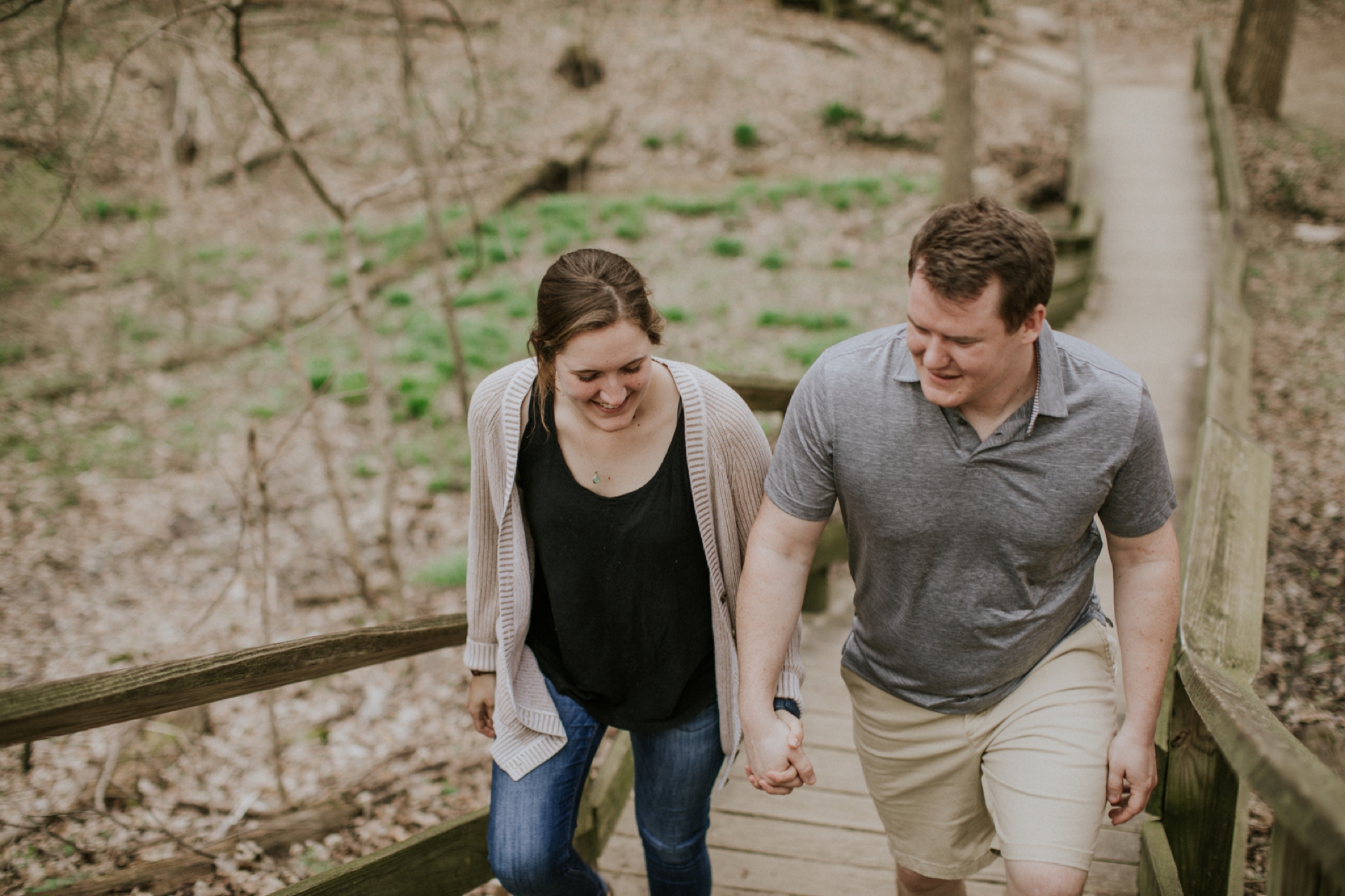 Engagement Session Couple Walking Up Wooden Steps in Holliday Park