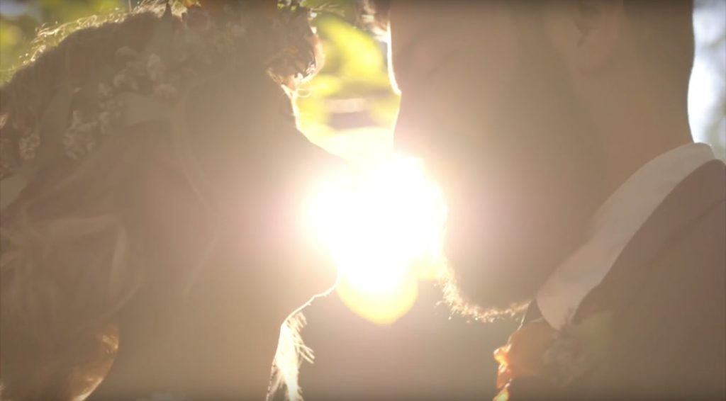 bride and groom look at each other with love during their benton house wedding film at sunset