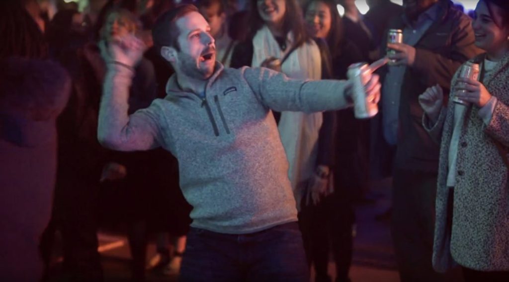 man dances crazily at a pattern indy launch party