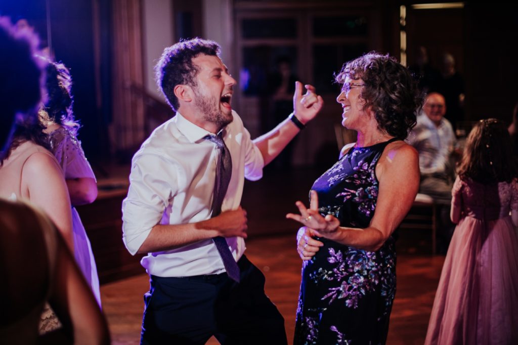 mother of bride and son dance to bohemian rhapsody by queen at indiana landmarks wedding