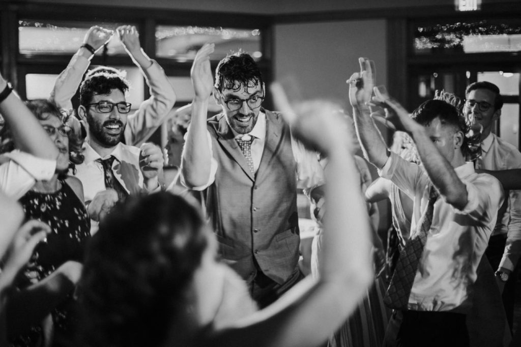 black and white photo of groom dancing at indiana landmarks wedding