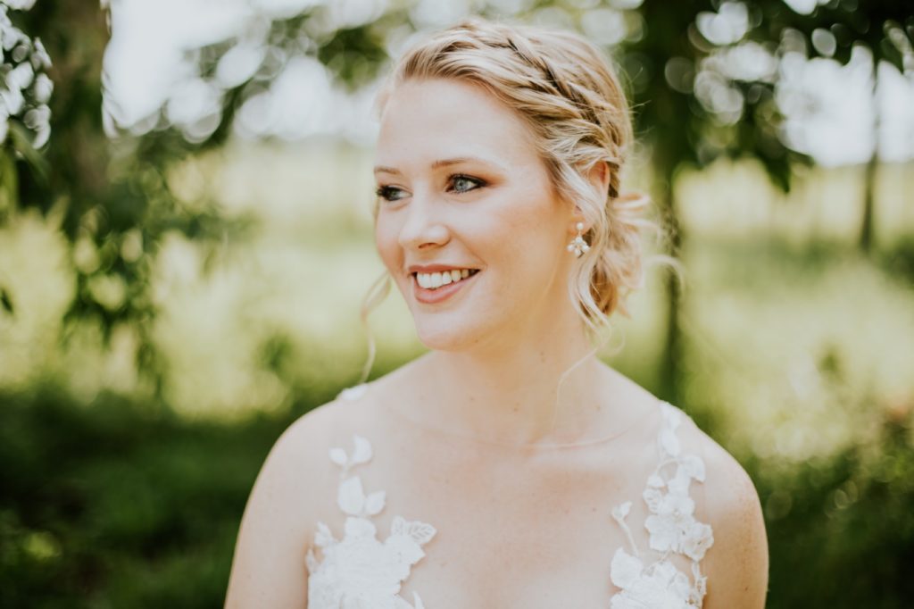 shallow depth of field head shot of bride in wooded area for this muncie wedding photography