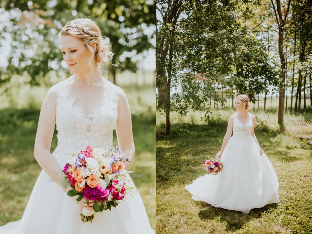 bride walks through a sunny clearing in the woods for this muncie wedding photography