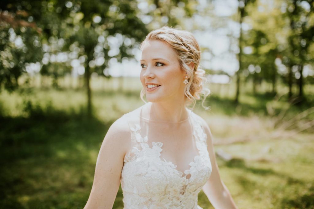 bride looks over her shoulder for her muncie wedding photography