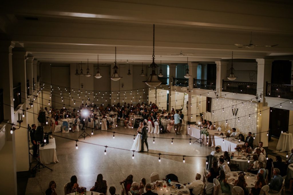 wide shot from balcony of bride and groom's first dance at cornerstone for their muncie wedding photography