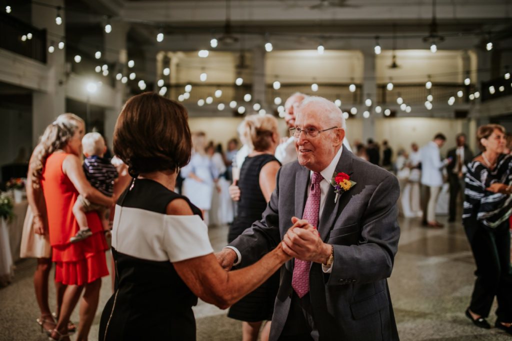old man dances with younger woman at cornerstone center for the arts
