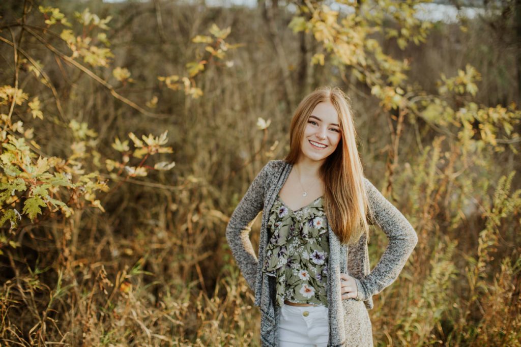 girl in sweater with hands on her hips in Fishers portraits