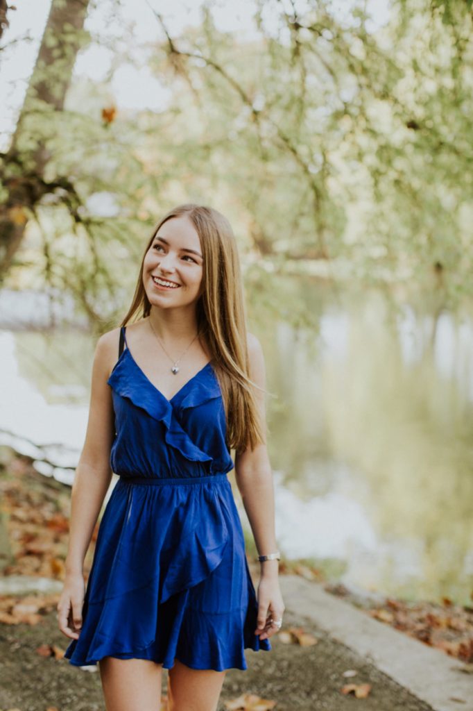 Girl in blue dress next to waterfront for Noblesville Senior Portraits