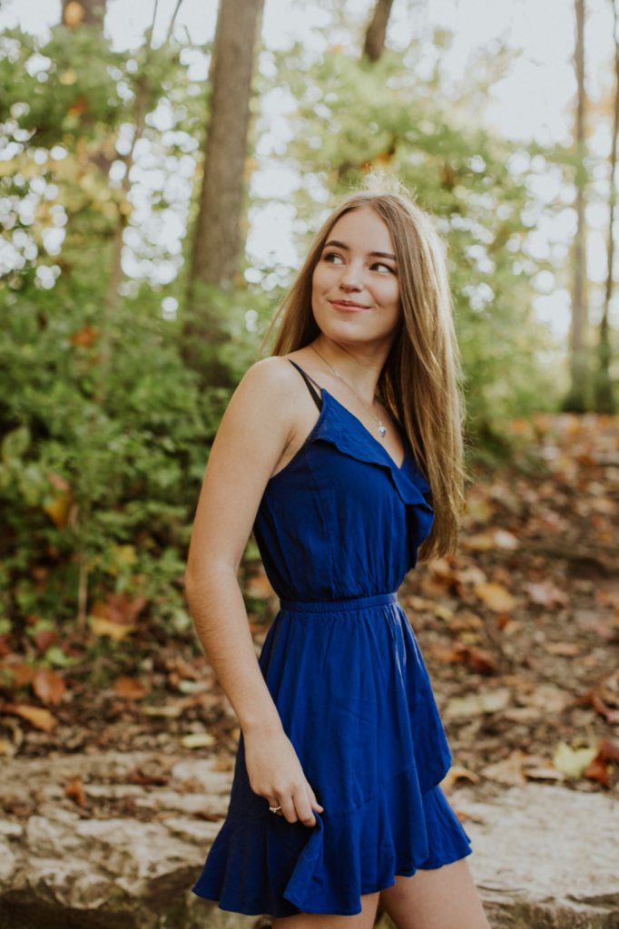 girl in blue dress in woods for Zionsville photos