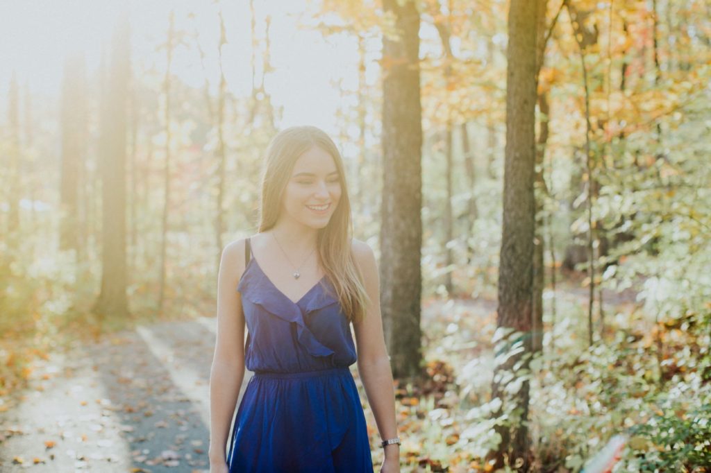 girl in blue dress with sunset behind her for Noblesville Senior Portraits