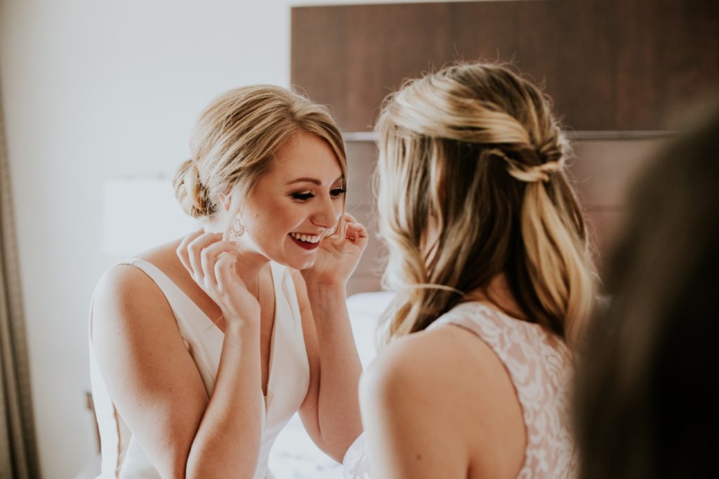 maid of honor looks at bride in westin hotel room