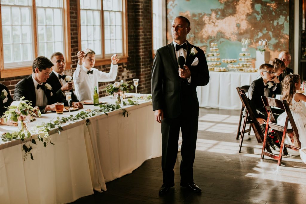 father of the bride gives a speech during a Tinker House Wedding