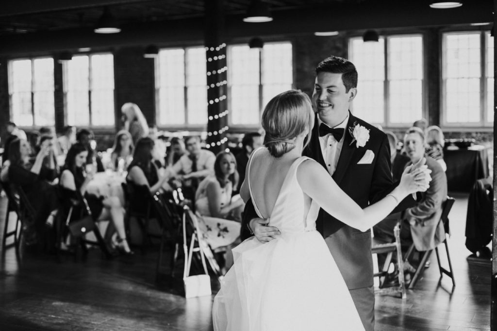 black and white photo of bride and groom dancing at their Tinker House Wedding