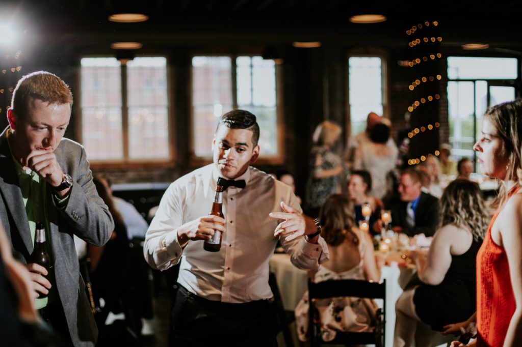 a groomsman dances wildly at Tinker House Events