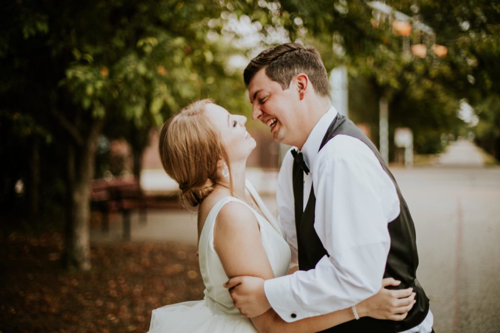 bride and groom prepare to kiss during golden hour during their Tinker House Wedding