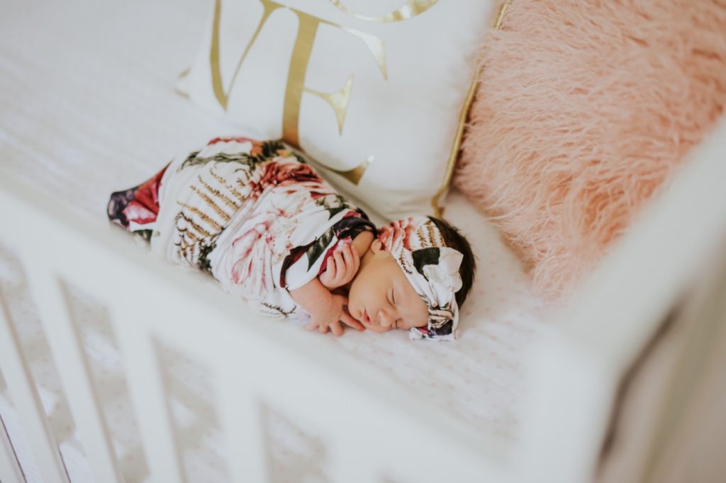 newborn baby sleeping in crib for carmel family portraits