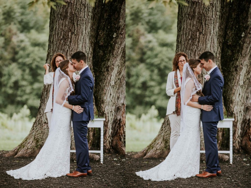bride and groom kiss and laugh under an old tree during their wedding ceremony for Noblesville Wedding Photography
