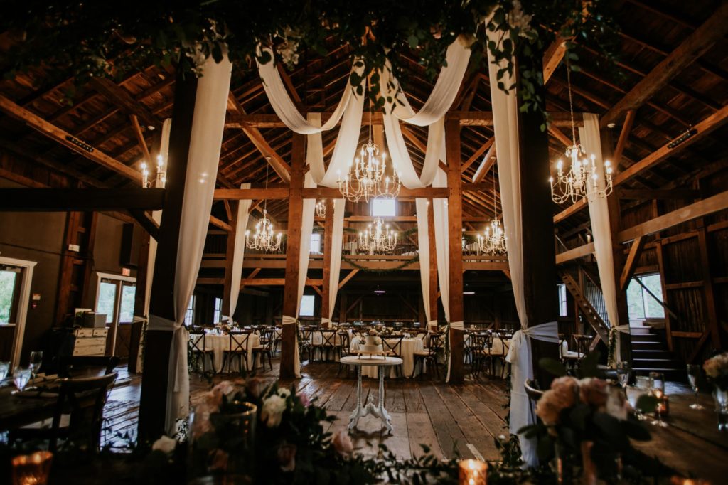 wide shot of the interior of barn at mustard seed gardens with drapery for Noblesville Wedding Photography
