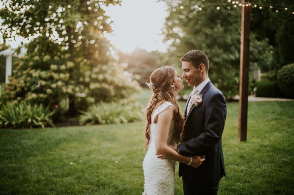 bride and groom hold each other at sunset at mustard seed gardens for Noblesville Wedding Photography