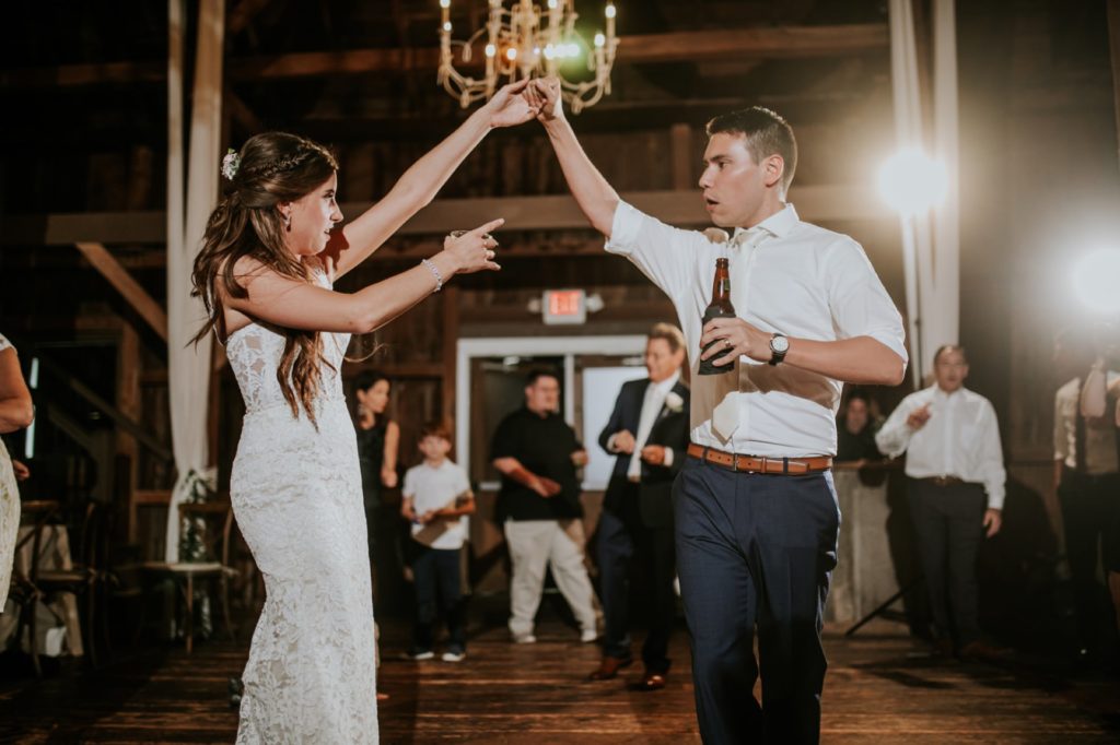 bride and groom dance with drinks and guests at mustard seed gardens for Noblesville Wedding Photography