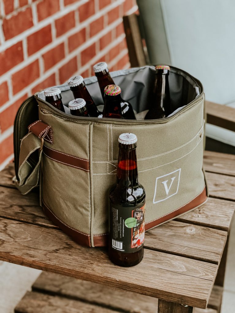 Portable cloth cooler with several beers inside and one beer outside combat cooler from groovy guy gifts