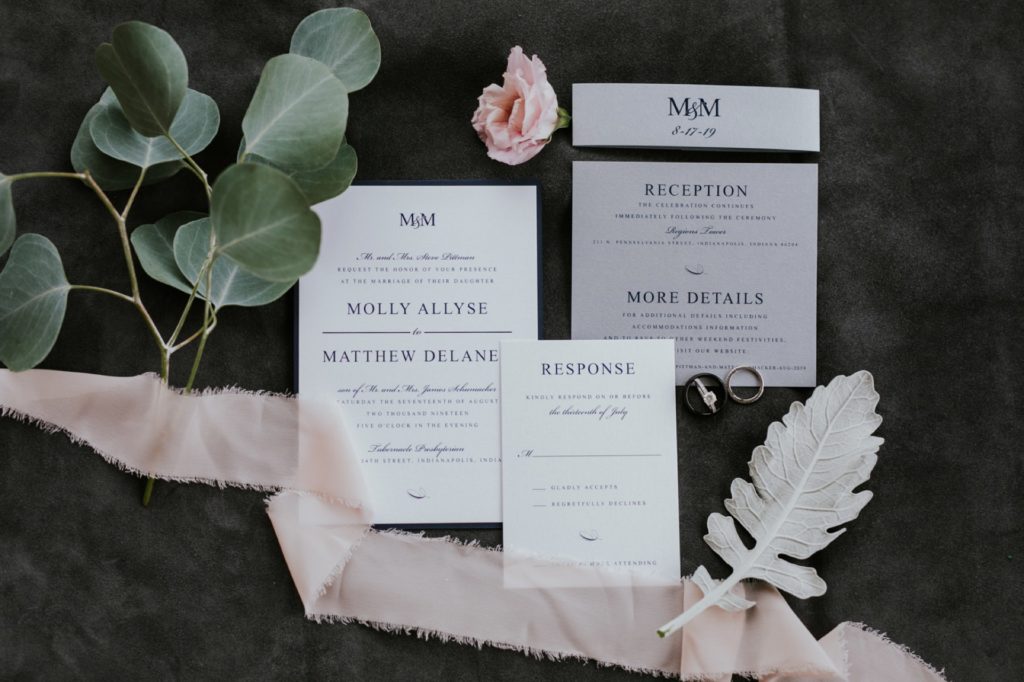 wedding invitations and floral on suede in Regions Tower wedding