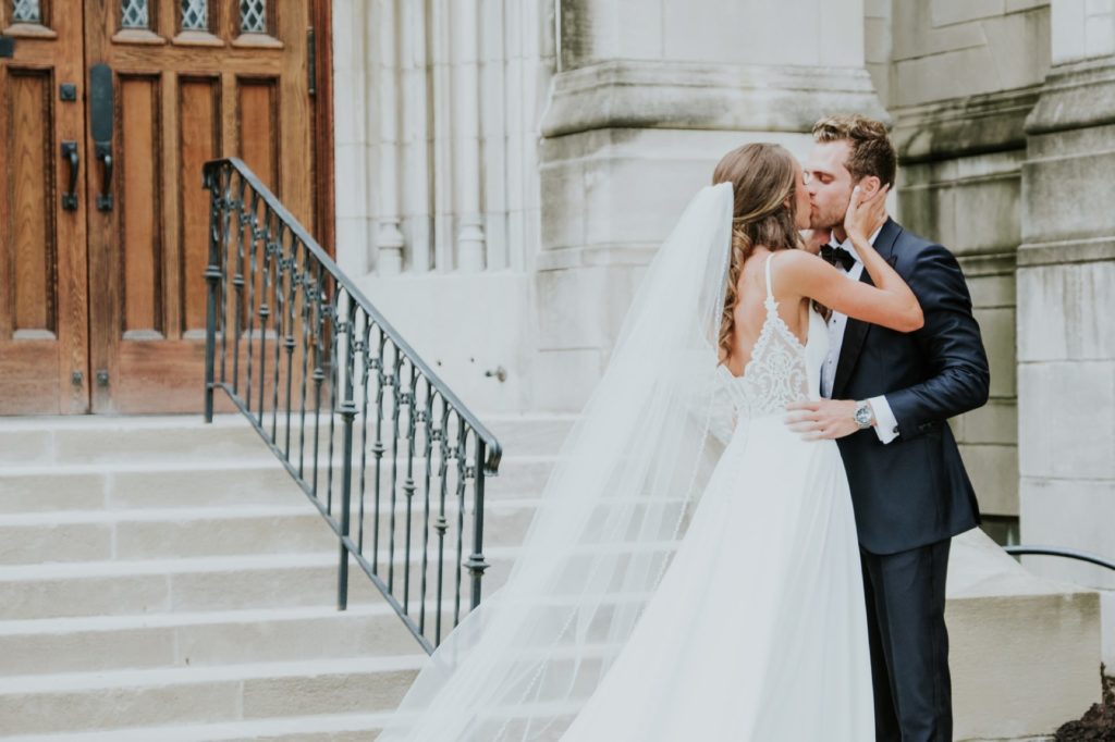 bride and groom kiss during first look at tabernacle presbyterian