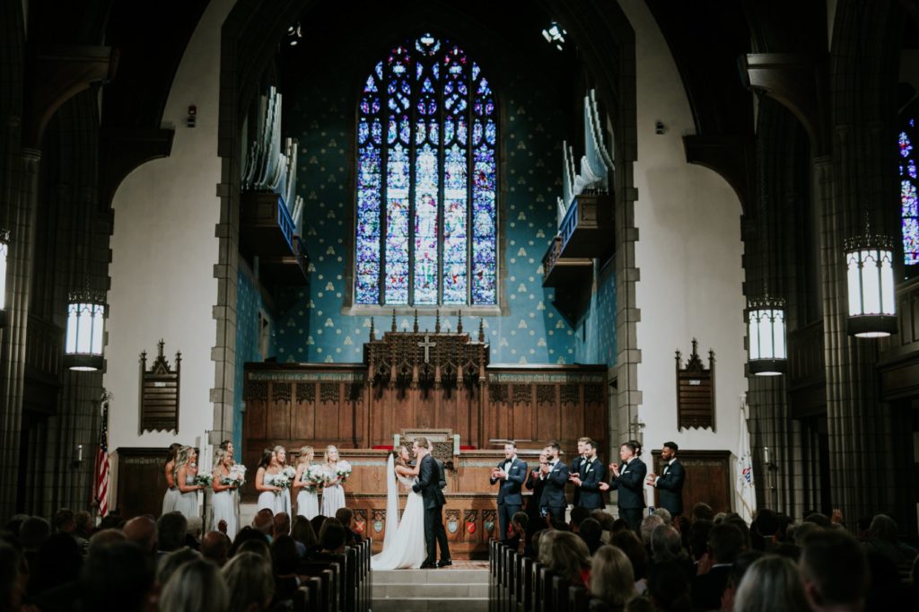 wide shot of bride and groom after first kiss at tabernacle presbyterian church wedding photographer