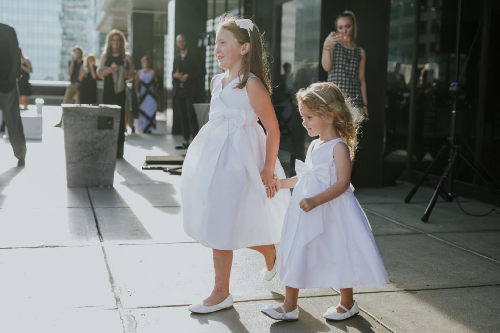 flower girls enter reception for regions tower wedding