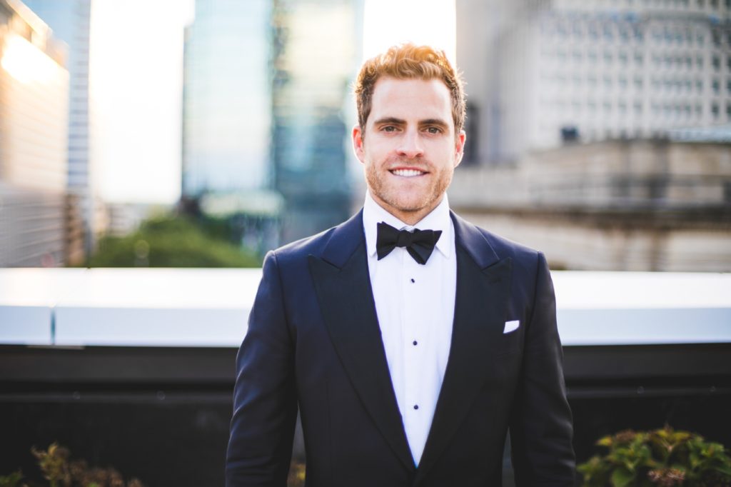 groom at sunset for Regions Tower wedding for indy photographer
