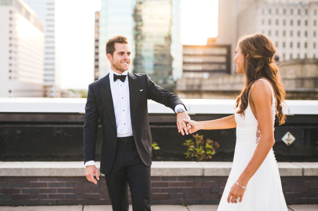 bride and groom walk on Regions Tower rooftop for Indy Photography