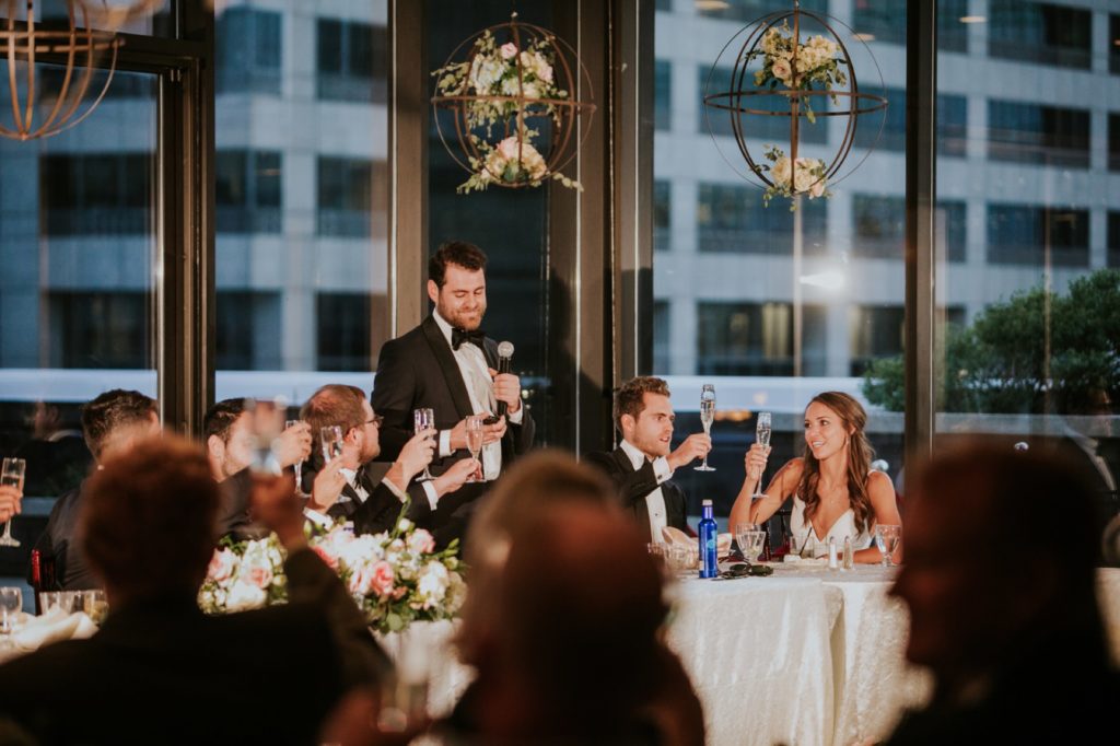 groomsman gives toast to bride and groom for Indy wedding photography