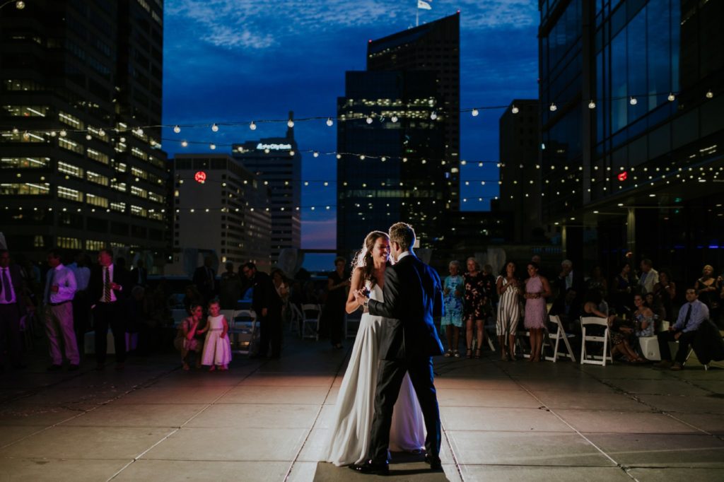 bride and groom dance on rooftop at night for Regions Tower wedding photography in Indianapolis