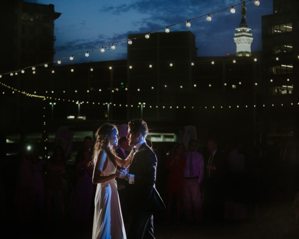 bride and groom dance on empty rooftop for Regions Tower wedding in Indianapolis Photographer