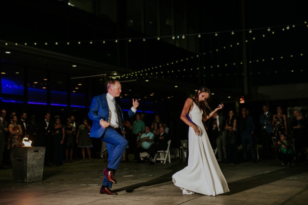 father and bride dance at night on rooftop in indianapolis