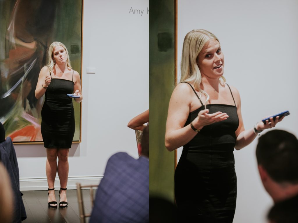 a woman in a little black dress gives a speech at Conrad Indianapolis Event Photography