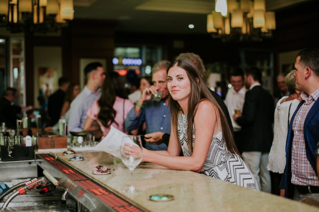 a young woman order wine at the Tastings Wine Bar for Conrad Indianapolis Event Photography