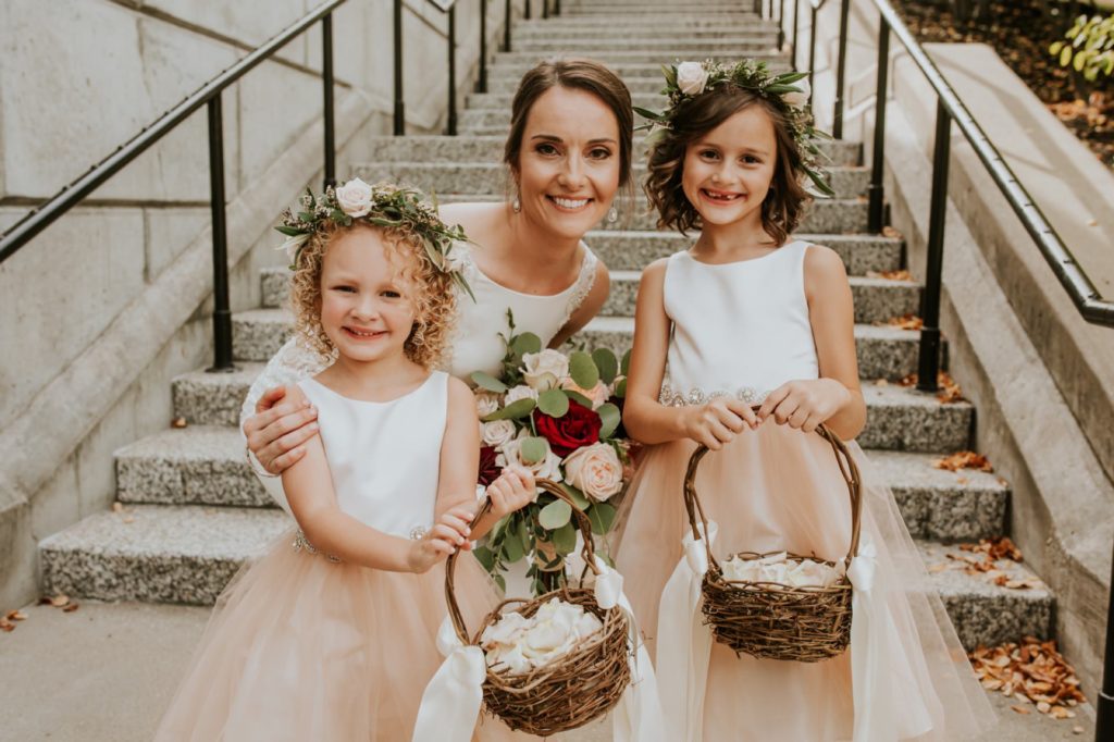 bride and flower girls in front of steps by canal 337 wedding