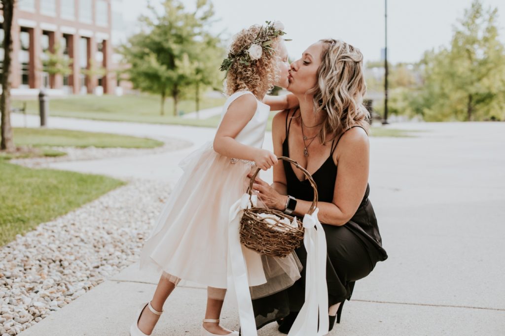 flower girl kisses her mother at canal 337 wedding