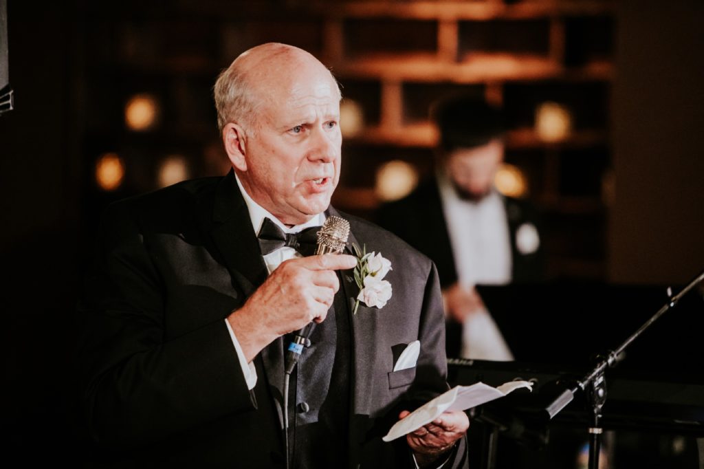 best man and father of groom gives toast at a canal 337 wedding