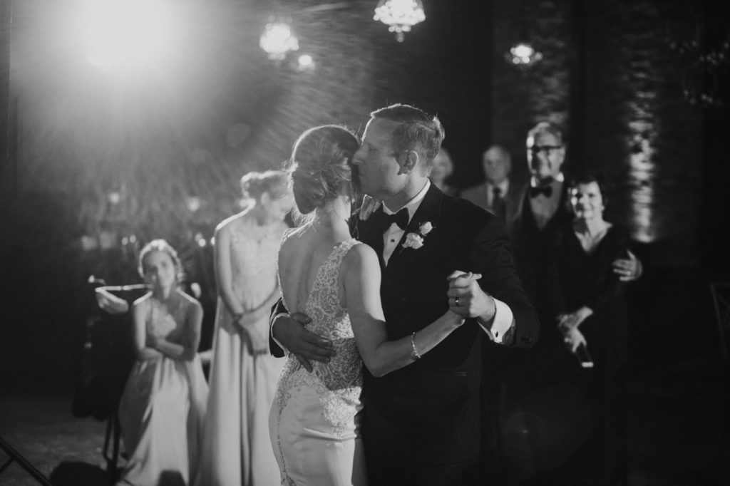 black and white photo of bride and groom's first dance in an industrial wedding venue in indianapolis