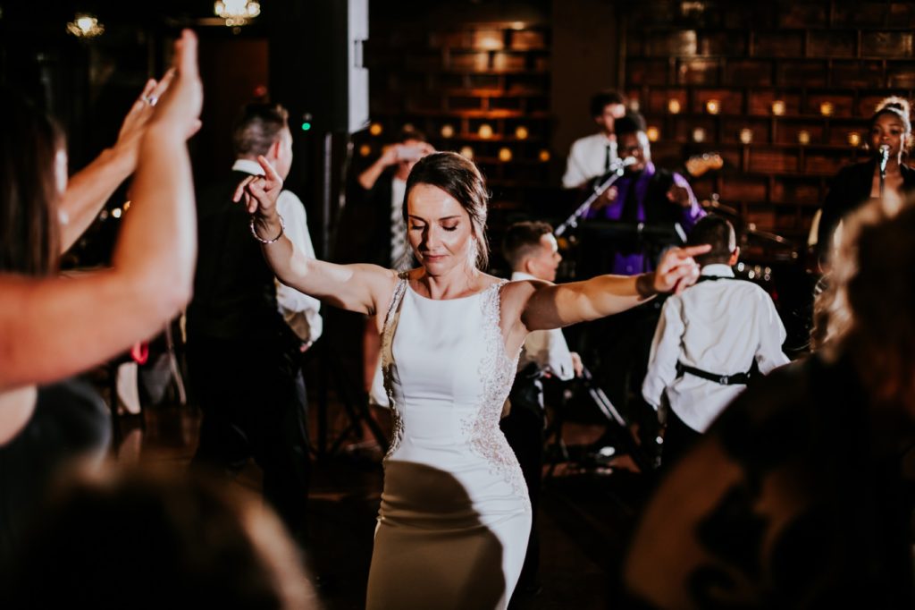 bride dancing during reception at an industrial wedding venue in downtown indianapolis