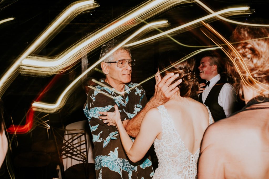 man dances with bride in shutter drag long exposure photo at canal 337 wedding