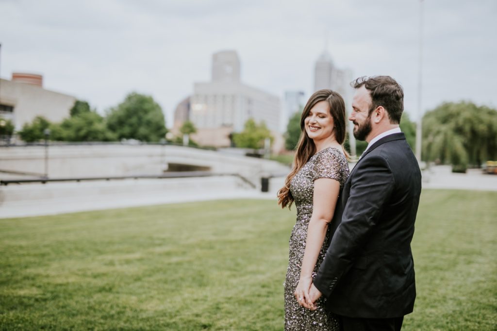 man and woman in formal wear in a park in downtown indianapolis