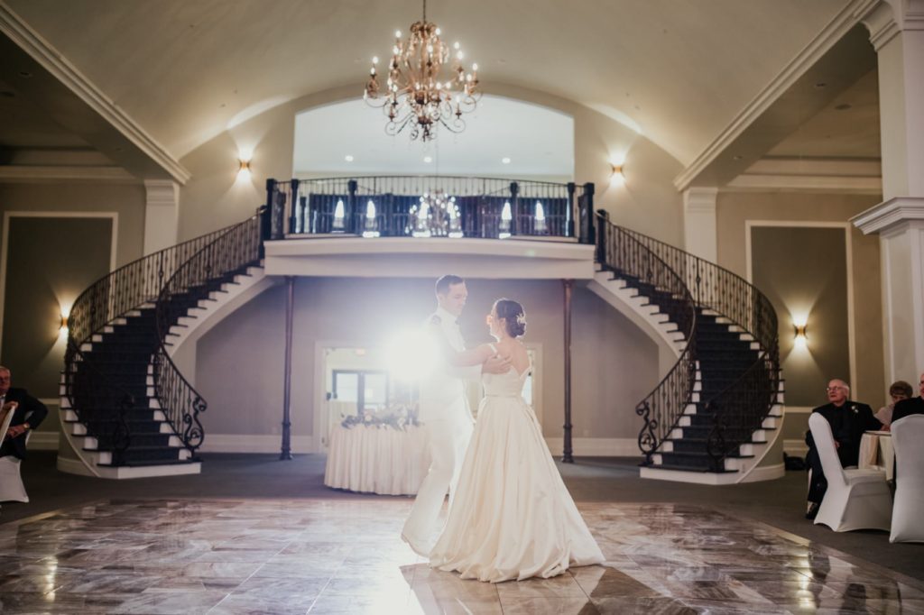 bride and groom first dance in front of entryway for Bel Air Kokomo Wedding