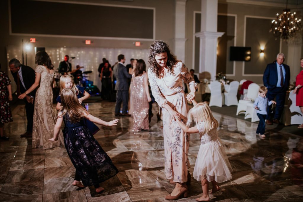 mom dances with children at Bel Air Kokomo Wedding