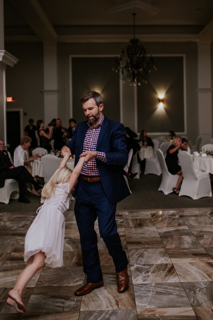 a father dances with his small daughter at a Bel Air Kokomo Wedding