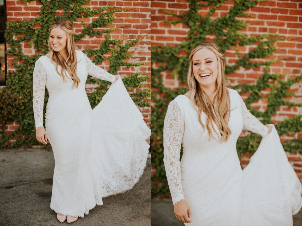 bride twirls dress around in front of brick and ivy before her VisionLoft Wedding