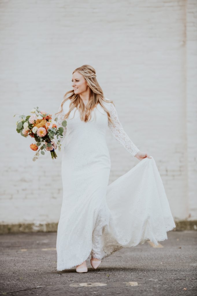 bride walking through parking lot before her downtown indy wedding